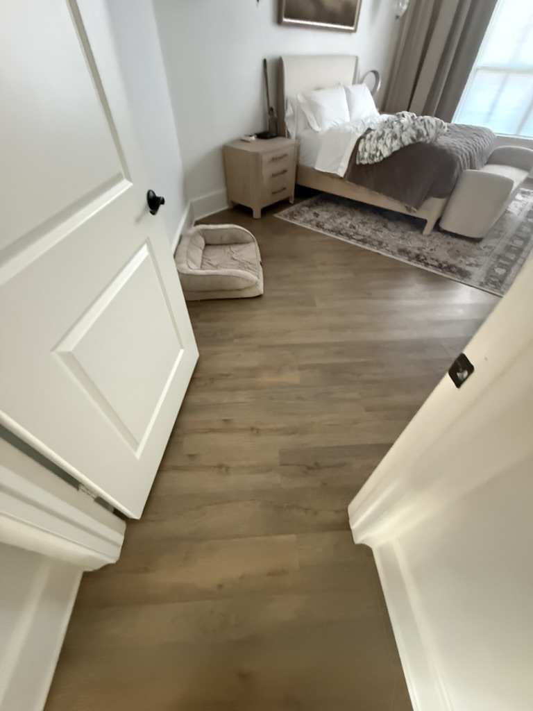 Secondary bedroom with restored flooring after water damage, Rowlett TX